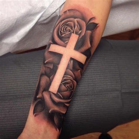 cross rose tattoo meaning|rose and cross tattoo forearm.